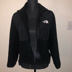 Woman’s black North Face jacket